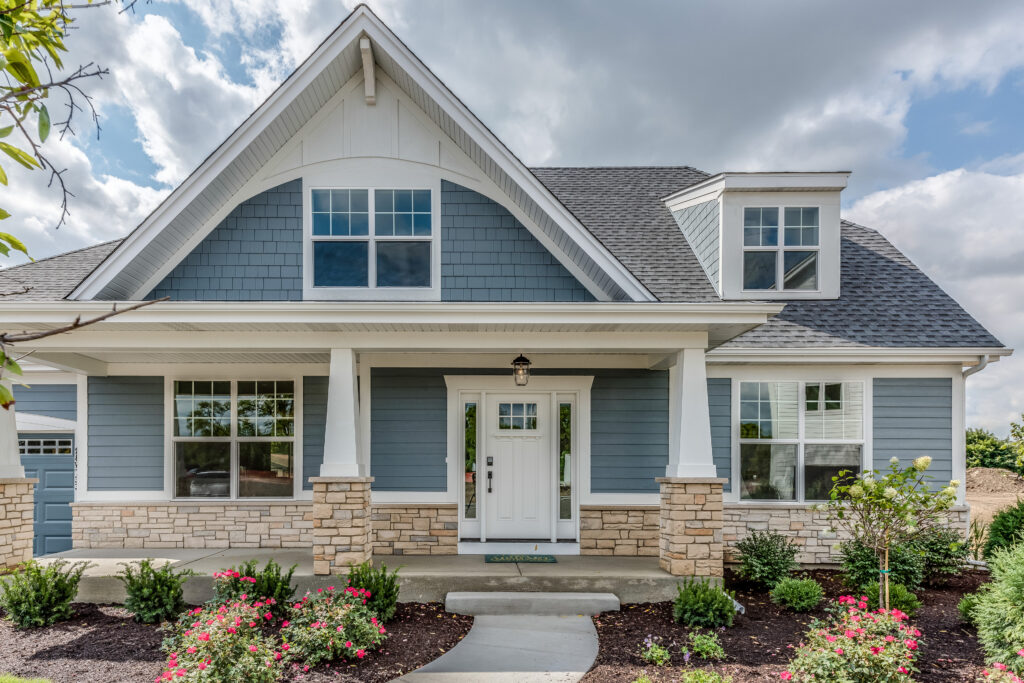 house with white front door and light blue siding