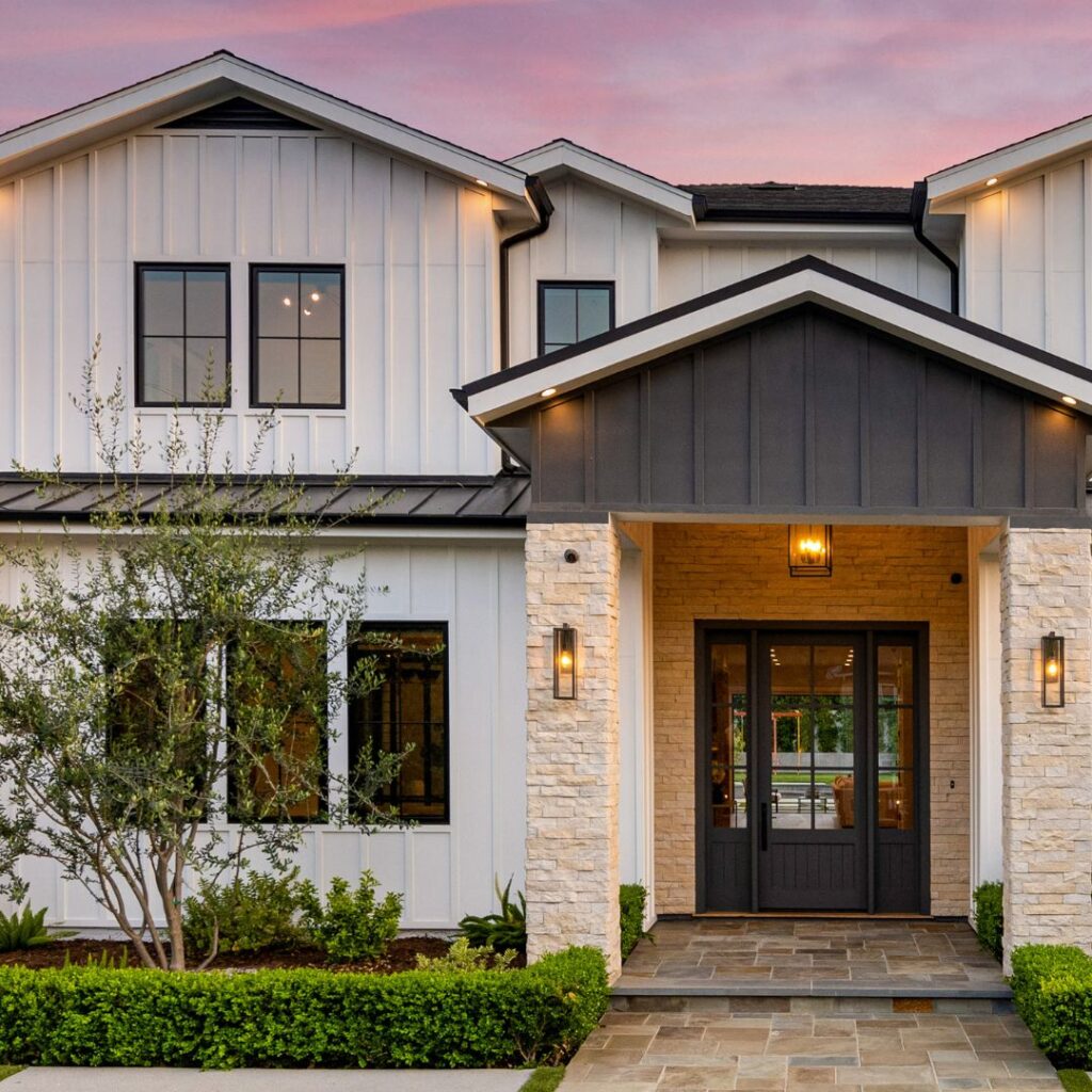 black front door with white siding and black trim