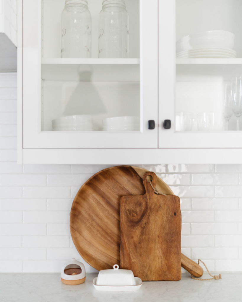 cutting board display on white kitchen counter top 