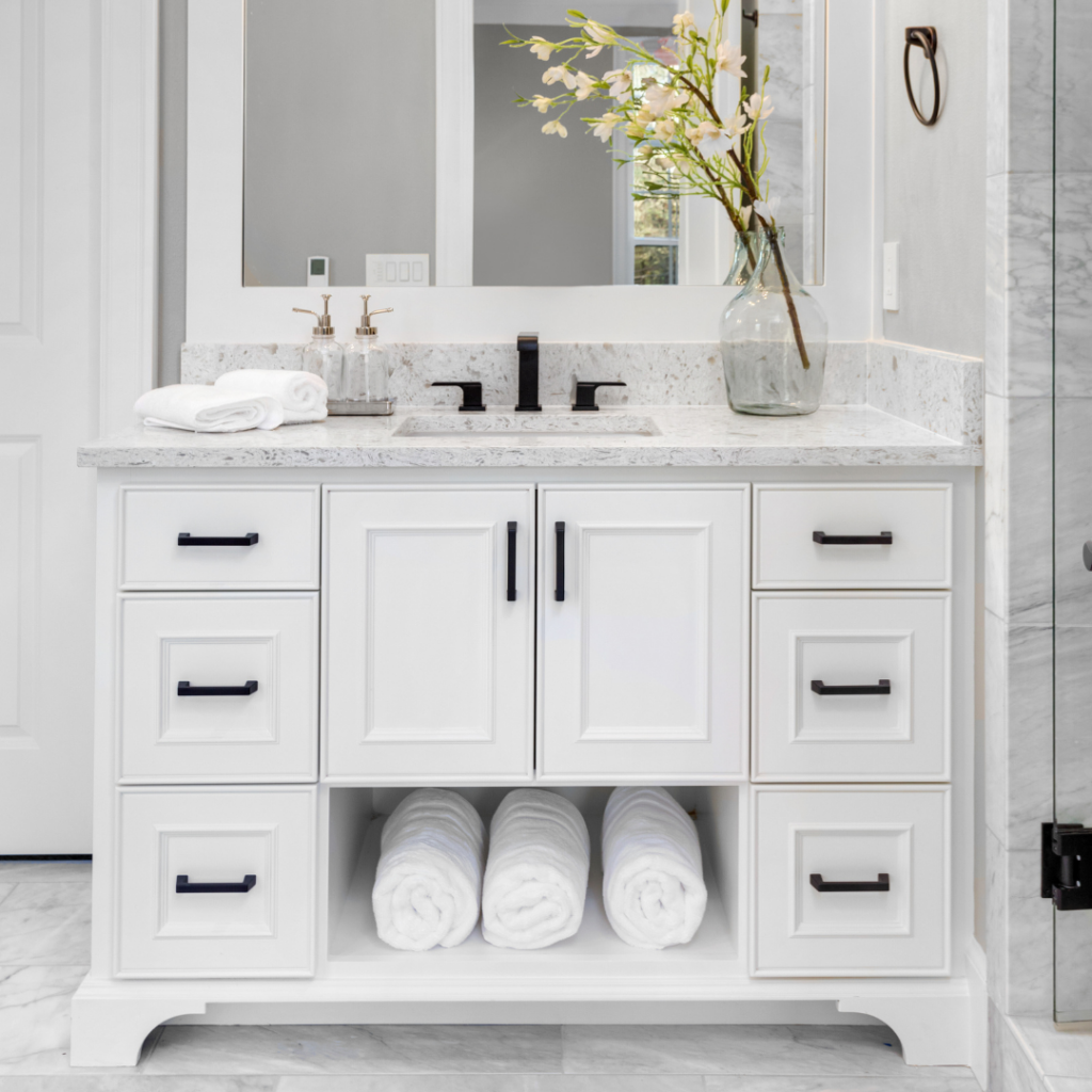 white bathroom vanity, black hardware
