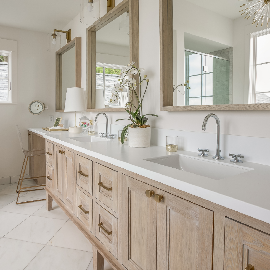 light wood vanity, white countertop, gold hardware, chrome faucets